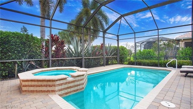 20029 Saraceno Dr, Estero, FL 33928 - outdoor pool with an in-ground hot tub, a patio area, and glass enclosure