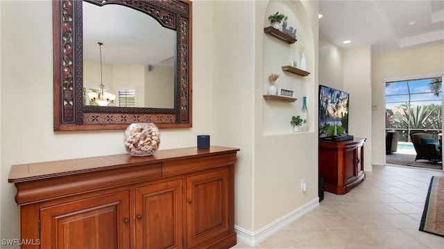20029 Saraceno Dr, Estero, FL 33928 - hall with light tile patterned floors and recessed lighting