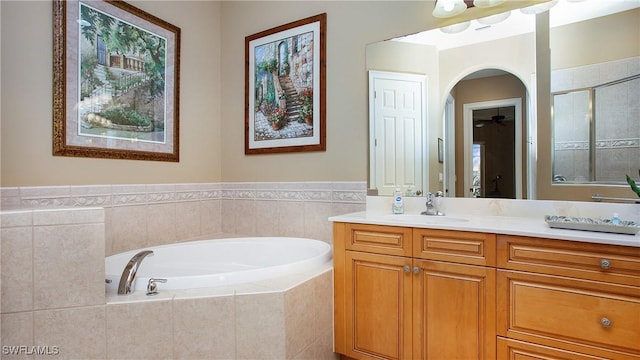 20029 Saraceno Dr, Estero, FL 33928 - full bathroom featuring a bath, vanity, a shower stall, and a ceiling fan