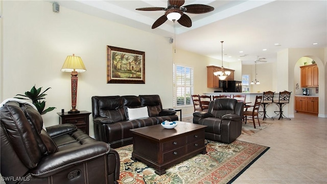 20029 Saraceno Dr, Estero, FL 33928 - living room with a ceiling fan, arched walkways, recessed lighting, a chandelier, and light tile patterned floors
