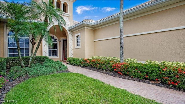 20029 Saraceno Dr, Estero, FL 33928 - entrance to property with stucco siding and a tiled roof