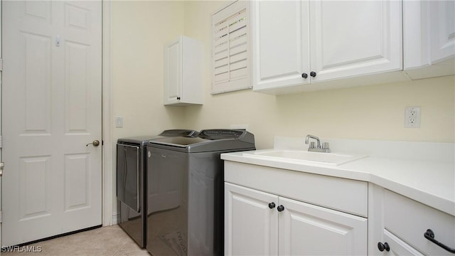 20029 Saraceno Dr, Estero, FL 33928 - washroom with cabinet space, washing machine and dryer, and light tile patterned flooring