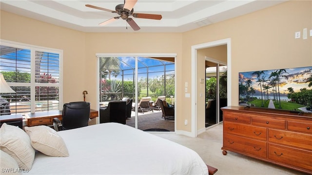 20029 Saraceno Dr, Estero, FL 33928 - bedroom with light carpet, access to outside, a raised ceiling, a sunroom, and ceiling fan