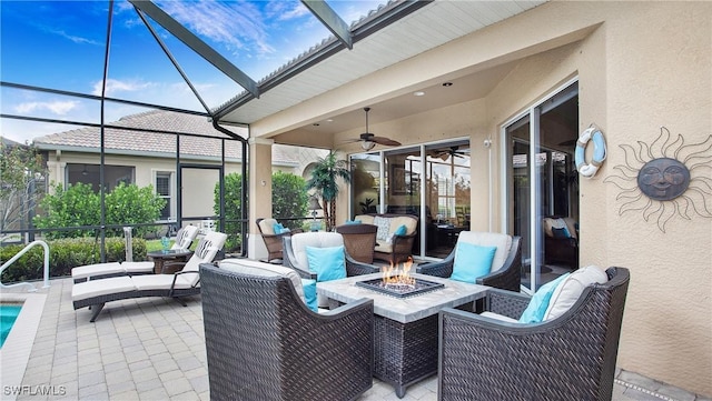 20029 Saraceno Dr, Estero, FL 33928 - view of patio / terrace featuring a lanai, an outdoor pool, ceiling fan, and an outdoor living space with a fire pit