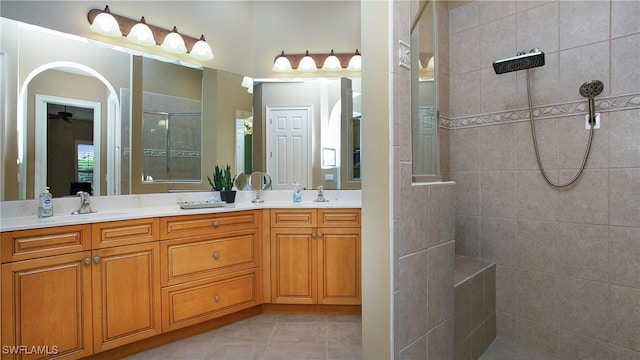 20029 Saraceno Dr, Estero, FL 33928 - full bathroom with a walk in shower, double vanity, ceiling fan, and tile patterned floors