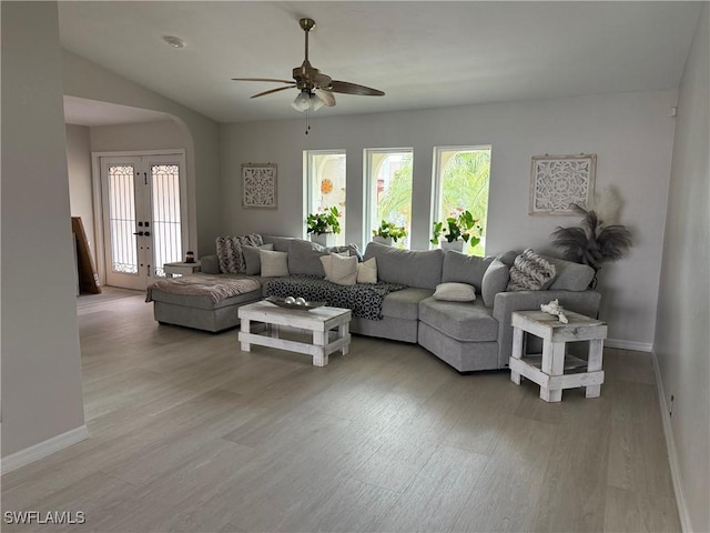804 SW Santa Barbara Pl, Cape Coral, FL 33991 - living area with healthy amount of natural light, light wood finished floors, ceiling fan, arched walkways, and vaulted ceiling