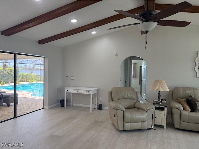 804 SW Santa Barbara Pl, Cape Coral, FL 33991 - living room featuring a ceiling fan, arched walkways, light wood-style flooring, and recessed lighting