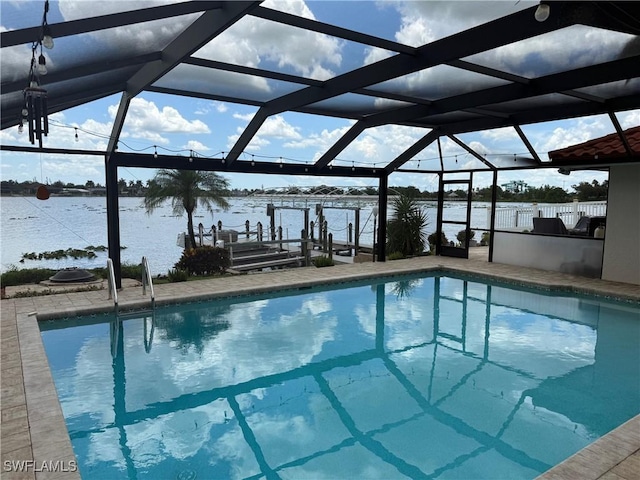 804 SW Santa Barbara Pl, Cape Coral, FL 33991 - swimming pool with a water view, boat lift, a boat dock, and a lanai