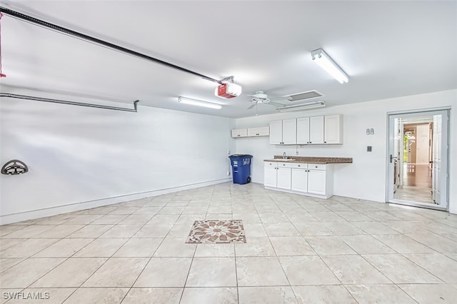 15050 Lakeside View Dr Unit 1003, Fort Myers, FL 33919 - garage with a garage door opener and ceiling fan