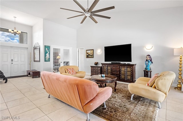 2502 SW 17th Ave, Cape Coral, FL 33914 - living area with light tile patterned floors, high vaulted ceiling, ceiling fan, and a chandelier