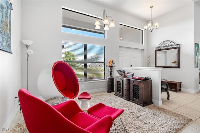 2502 SW 17th Ave, Cape Coral, FL 33914 - living area featuring a chandelier, healthy amount of natural light, tile patterned floors, and a high ceiling