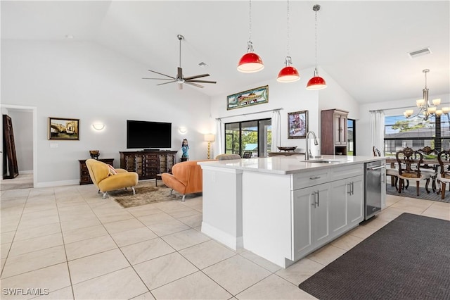 2502 SW 17th Ave, Cape Coral, FL 33914 - kitchen featuring high vaulted ceiling, a chandelier, light tile patterned flooring, light countertops, and pendant lighting