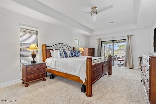 2502 SW 17th Ave, Cape Coral, FL 33914 - bedroom with access to exterior, a raised ceiling, light colored carpet, and a ceiling fan