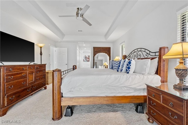 2502 SW 17th Ave, Cape Coral, FL 33914 - bedroom with light carpet, a raised ceiling, and ceiling fan