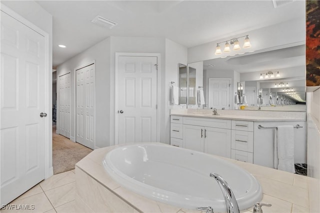 2502 SW 17th Ave, Cape Coral, FL 33914 - bathroom with a garden tub, vanity, tile patterned floors, and recessed lighting