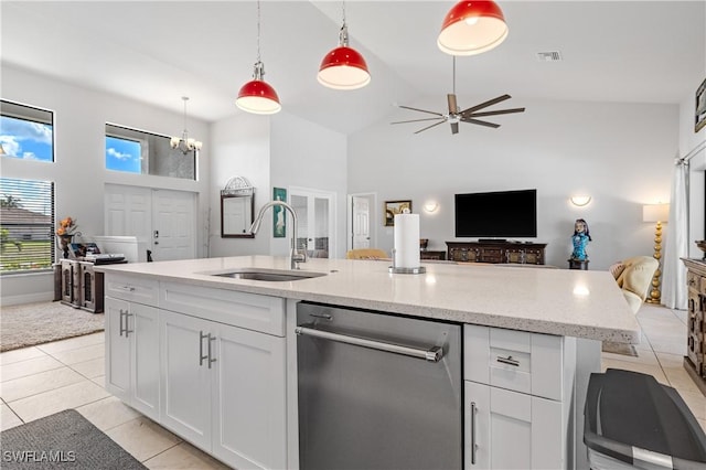 2502 SW 17th Ave, Cape Coral, FL 33914 - kitchen with stainless steel dishwasher, high vaulted ceiling, open floor plan, light tile patterned floors, and white cabinets