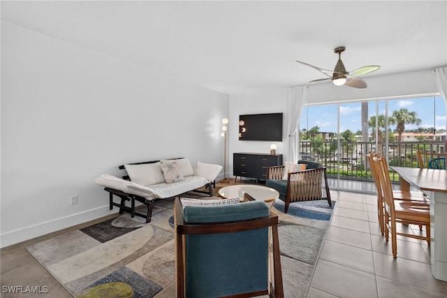 1666 Osprey Ave Unit 106, Naples, FL 34102 - living room with a ceiling fan and baseboards