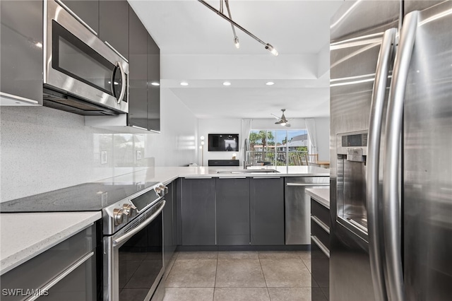 1666 Osprey Ave Unit 106, Naples, FL 34102 - kitchen featuring appliances with stainless steel finishes, gray cabinets, modern cabinets, light tile patterned flooring, and recessed lighting