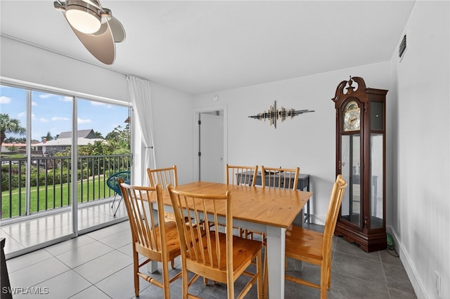 1666 Osprey Ave Unit 106, Naples, FL 34102 - tiled dining room featuring a ceiling fan and baseboards