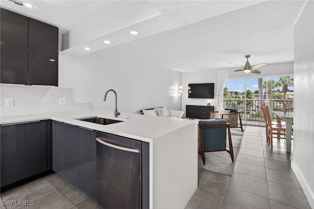 1666 Osprey Ave Unit 106, Naples, FL 34102 - kitchen featuring stainless steel dishwasher, modern cabinets, tile patterned floors, light countertops, and recessed lighting