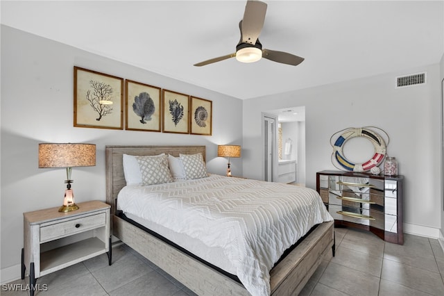 1666 Osprey Ave Unit 106, Naples, FL 34102 - bedroom with tile patterned floors, ceiling fan, and connected bathroom