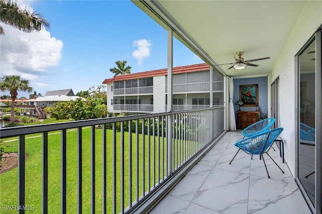 1666 Osprey Ave Unit 106, Naples, FL 34102 - balcony featuring a ceiling fan
