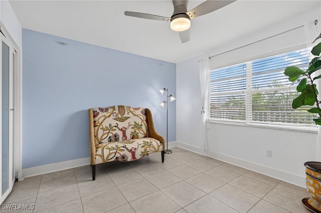 1666 Osprey Ave Unit 106, Naples, FL 34102 - living area with light tile patterned floors and a ceiling fan