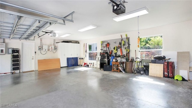 5961 Sea Grass Ln, Naples, FL 34116 - garage featuring a garage door opener