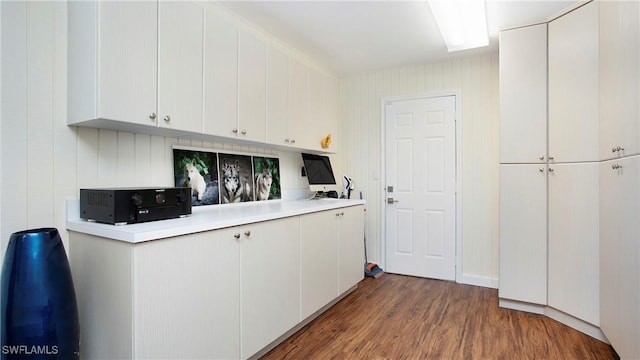 5961 Sea Grass Ln, Naples, FL 34116 - kitchen featuring light countertops, dark wood-style flooring, and white cabinets