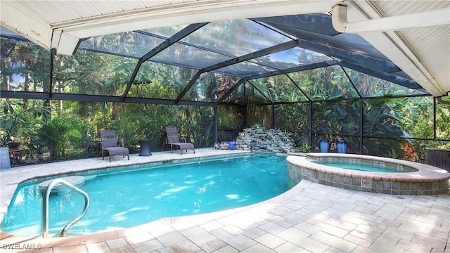 5961 Sea Grass Ln, Naples, FL 34116 - view of pool featuring a pool with connected hot tub, a lanai, and a patio area