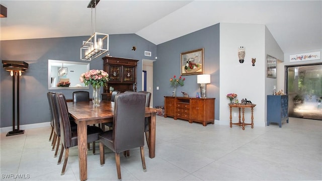 5961 Sea Grass Ln, Naples, FL 34116 - dining area featuring lofted ceiling, a chandelier, and light tile patterned floors