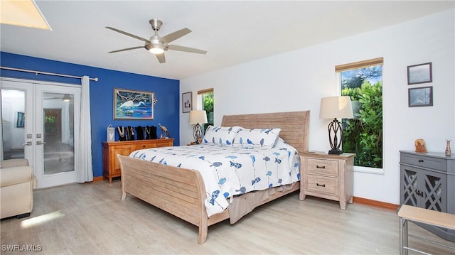 5961 Sea Grass Ln, Naples, FL 34116 - bedroom with french doors, access to outside, light wood-style flooring, and a ceiling fan