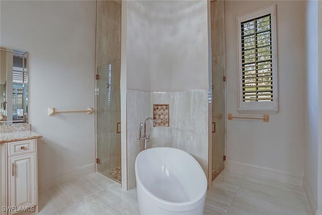 9691 Monteverdi Way, Fort Myers, FL 33912 - full bath featuring vanity, a freestanding bath, a stall shower, and tile patterned flooring