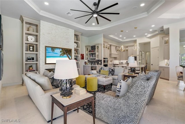 9691 Monteverdi Way, Fort Myers, FL 33912 - living room featuring a ceiling fan, a tray ceiling, crown molding, and recessed lighting