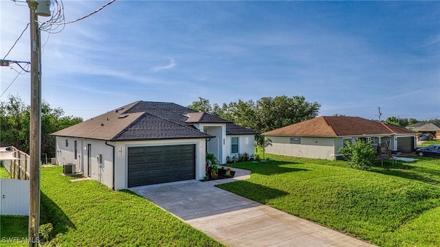 807 Hamilton Ave, Lehigh Acres, FL 33972 - ranch-style house with roof with shingles, a detached garage, and stucco siding
