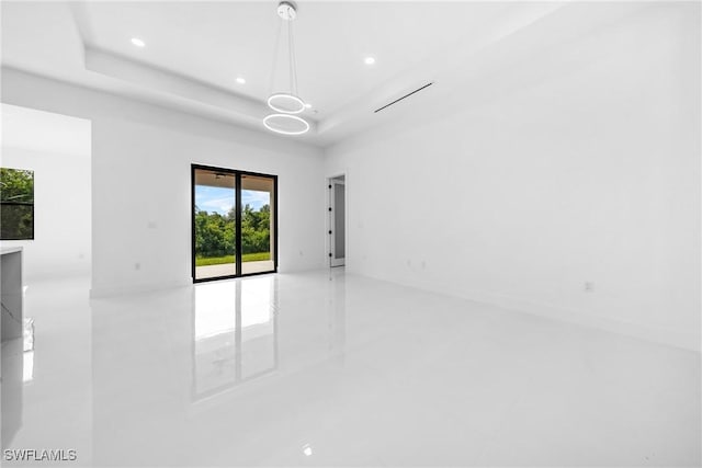 807 Hamilton Ave, Lehigh Acres, FL 33972 - empty room featuring plenty of natural light, recessed lighting, and a tray ceiling