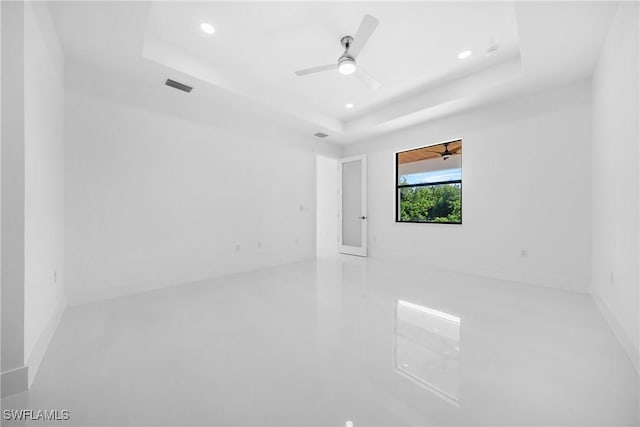 807 Hamilton Ave, Lehigh Acres, FL 33972 - unfurnished room featuring a tray ceiling, recessed lighting, and a ceiling fan
