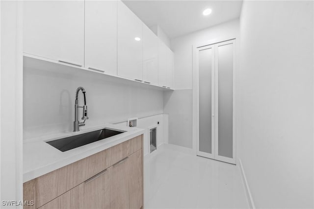 807 Hamilton Ave, Lehigh Acres, FL 33972 - laundry room with cabinet space, hookup for a washing machine, recessed lighting, and electric dryer hookup