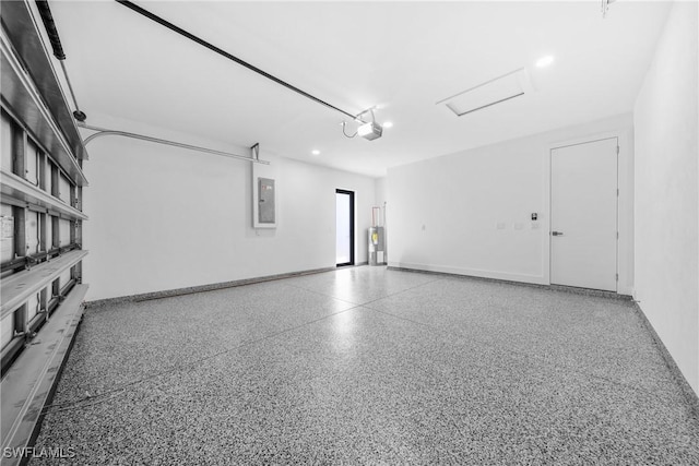 807 Hamilton Ave, Lehigh Acres, FL 33972 - garage with electric panel, a garage door opener, and water heater