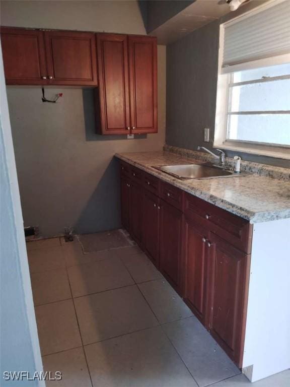 873 Van Buren St, Fort Myers, FL 33916 - kitchen featuring a sink and light tile patterned flooring