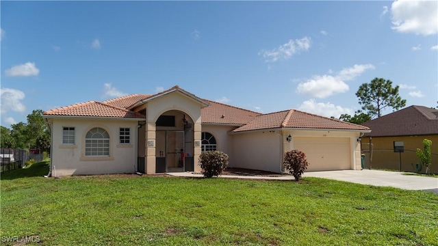 2041 24th Ave NE, Naples, FL 34120 - mediterranean / spanish house featuring a tiled roof, stucco siding, driveway, and a garage