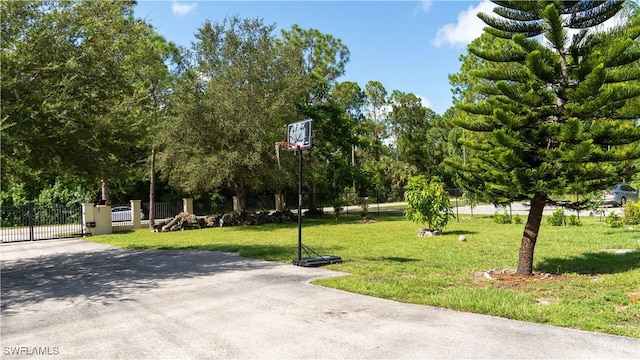2041 24th Ave NE, Naples, FL 34120 - view of community with a gate and driveway