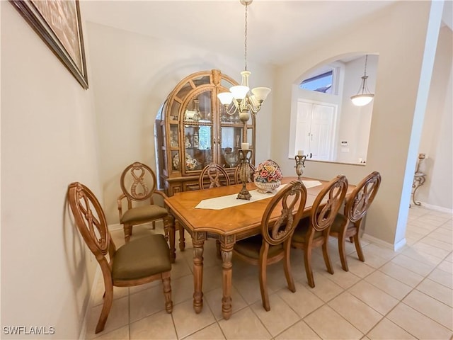 2041 24th Ave NE, Naples, FL 34120 - dining room featuring a chandelier and light tile patterned flooring