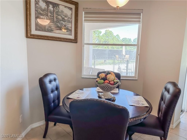 2041 24th Ave NE, Naples, FL 34120 - dining room featuring light tile patterned floors and baseboards