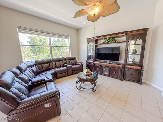 2041 24th Ave NE, Naples, FL 34120 - living room featuring a ceiling fan and light tile patterned floors