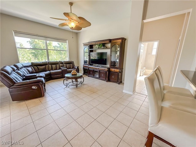 2041 24th Ave NE, Naples, FL 34120 - living area with light tile patterned floors and a ceiling fan