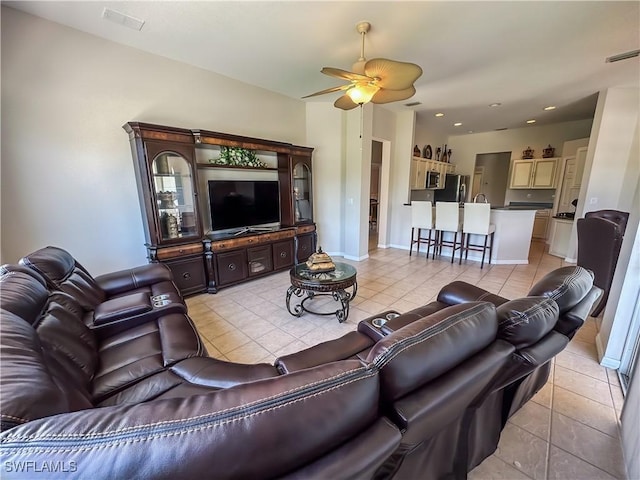 2041 24th Ave NE, Naples, FL 34120 - living area with light tile patterned floors, ceiling fan, and recessed lighting