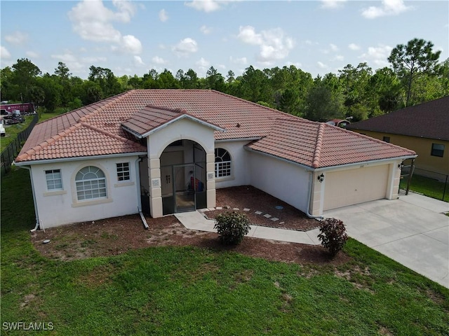 2041 24th Ave NE, Naples, FL 34120 - mediterranean / spanish-style house with a tile roof, an attached garage, driveway, stucco siding, and a front yard
