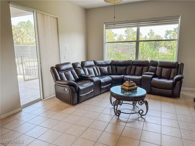 2041 24th Ave NE, Naples, FL 34120 - living room with light tile patterned floors and healthy amount of natural light