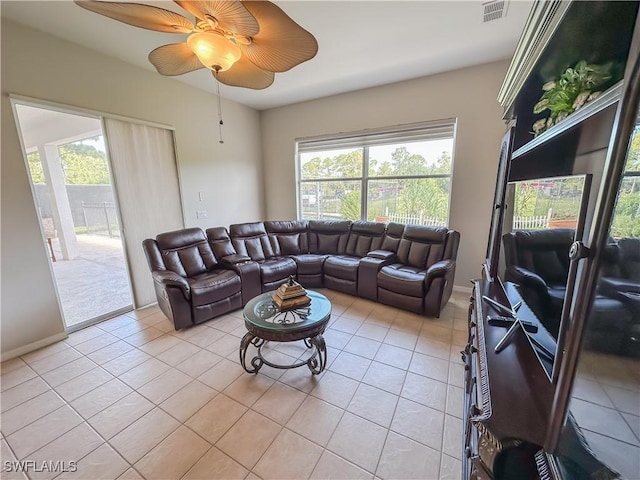 2041 24th Ave NE, Naples, FL 34120 - living area featuring light tile patterned flooring and ceiling fan
